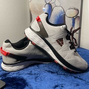 Gray and Black Athletic Sneakers with Red Accents, size 10 (pre-owned).